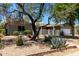 Charming home featuring xeriscape landscaping, a welcoming patio, and an attached two-car garage at 1502 E Minton Dr, Tempe, AZ 85282