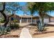 Charming home featuring xeriscape landscaping and a welcoming patio, with gravel and brick accents at 1502 E Minton Dr, Tempe, AZ 85282