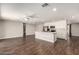Open-concept kitchen with white cabinets, stainless steel appliances, and a center island with sink at 1502 E Minton Dr, Tempe, AZ 85282