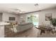 Stylish open floor plan connecting the living area, dining space, and a glimpse of the pool at 1502 E Minton Dr, Tempe, AZ 85282