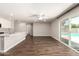 Bright living space with wood floors, a view of the pool, and seamless flow to the kitchen at 1502 E Minton Dr, Tempe, AZ 85282