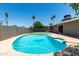 Sparkling pool in a private backyard oasis, surrounded by mature trees and landscaping at 1502 E Minton Dr, Tempe, AZ 85282