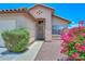 Inviting front entrance with well-kept landscaping and a charming facade at 1527 S 219Th Ln, Buckeye, AZ 85326
