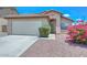 Charming home featuring well-maintained landscaping and a two-car garage at 1527 S 219Th Ln, Buckeye, AZ 85326