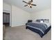 Spacious main bedroom featuring a ceiling fan and a leather chair in the corner at 1527 S 219Th Ln, Buckeye, AZ 85326