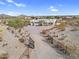 Aerial view of the estate, showcasing its private entrance and expansive desert landscape at 1550 W Adobe Dam Dr, San Tan Valley, AZ 85144