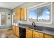Bright kitchen with dual windows offering views of the outside landscape at 1550 W Adobe Dam Dr, San Tan Valley, AZ 85144