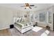 Sunlit bedroom with a ceiling fan and views of the surrounding area at 1550 W Adobe Dam Dr, San Tan Valley, AZ 85144