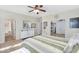 Spacious primary bedroom featuring hard surface floors and ensuite bathroom at 1550 W Adobe Dam Dr, San Tan Valley, AZ 85144