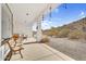 Inviting covered patio with rustic bench seating, providing a tranquil retreat and scenic backdrop at 1550 W Adobe Dam Dr, San Tan Valley, AZ 85144