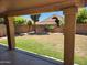 Inviting backyard view from covered patio with green grass, plants, and block wall at 1643 E Oakland St, Chandler, AZ 85225