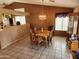 The dining room features neutral colors, tiled floors, and a chandelier over the dining table at 1643 E Oakland St, Chandler, AZ 85225
