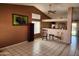 Open-concept living room with tile flooring, high ceilings, and an adjacent dining area bathed in natural light at 1643 E Oakland St, Chandler, AZ 85225