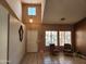Cozy living room featuring neutral colors, tiled floors, and an abundance of natural light from the windows at 1643 E Oakland St, Chandler, AZ 85225
