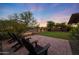 Inviting backyard with patio seating and beautifully maintained landscaping at 18835 W San Miguel Ave, Litchfield Park, AZ 85340