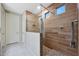 This bathroom boasts a stylish tiled shower and sleek fixtures at 18835 W San Miguel Ave, Litchfield Park, AZ 85340