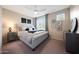 Cozy bedroom with a comfortable bed, stylish furniture, and natural light at 18835 W San Miguel Ave, Litchfield Park, AZ 85340