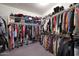 Spacious walk-in closet with ample shelving and hanging space for clothes and accessories at 18835 W San Miguel Ave, Litchfield Park, AZ 85340