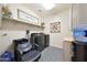 Convenient laundry room with modern washer/dryer, utility sink, and ample storage space at 18835 W San Miguel Ave, Litchfield Park, AZ 85340