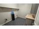 Clean laundry room with custom tile floor and counter space at 18835 W San Miguel Ave, Litchfield Park, AZ 85340