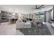 Spacious living room featuring an open floor plan, plush seating, a modern ceiling fan, and natural light at 18835 W San Miguel Ave, Litchfield Park, AZ 85340