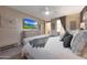Comfortable main bedroom featuring a luxurious bed, accent furniture, and a spacious layout, perfect for relaxation at 18835 W San Miguel Ave, Litchfield Park, AZ 85340