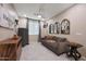 Cozy sitting room with a comfortable sofa, stylish decor, and natural light for relaxation at 18835 W San Miguel Ave, Litchfield Park, AZ 85340