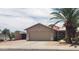 Charming single-story home featuring a well-maintained yard and two-car garage at 2004 N 108Th Dr, Avondale, AZ 85392