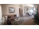 Comfortable living room with stylish furnishings and a view of the dining area at 2004 N 108Th Dr, Avondale, AZ 85392