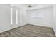 This bright bedroom has gray floors, lots of light and a ceiling fan at 211 N 7Th St, Avondale, AZ 85323