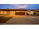 Home includes an attached garage with a modern door and plenty of space for parking and storage at 211 N 7Th St, Avondale, AZ 85323