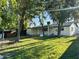 Lush backyard with mature trees and a covered patio, ideal for outdoor gatherings and relaxation at 2201 N 29Th Pl, Phoenix, AZ 85008