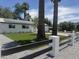 Landscaped front yard with grass and gravel accents, enclosed by a decorative fence at 2201 N 29Th Pl, Phoenix, AZ 85008