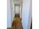 Neutral hallway featuring modern floors, clean lines, and access to multiple rooms at 2201 N 29Th Pl, Phoenix, AZ 85008
