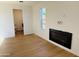Bright living room featuring a window and fireplace at 2201 N 29Th Pl, Phoenix, AZ 85008