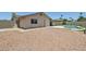 Wide shot of backyard featuring pool and updated landscaping with desert rock at 2519 E Geneva Dr, Tempe, AZ 85282
