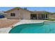 Backyard featuring pool, patio, updated landscaping, and covered outdoor seating area at 2519 E Geneva Dr, Tempe, AZ 85282