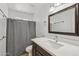 Bathroom with updated vanity, mirror, and a shower with gray curtain at 2519 E Geneva Dr, Tempe, AZ 85282