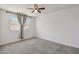 Bright bedroom with a window that provides natural light, creating a warm and inviting space at 2519 E Geneva Dr, Tempe, AZ 85282