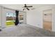 Carpeted bedroom with backyard views and a connecting door to another room at 2519 E Geneva Dr, Tempe, AZ 85282
