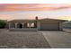 Charming single-story home featuring an arched entryway and a desert landscape at 2519 E Geneva Dr, Tempe, AZ 85282
