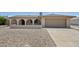 Charming home with arched porch and desert landscaping for easy maintenance at 2519 E Geneva Dr, Tempe, AZ 85282