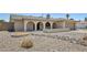 Charming home featuring an arched porch, gravel landscaping, and a desert-style aesthetic at 2519 E Geneva Dr, Tempe, AZ 85282