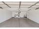 Spacious two car garage with washer and dryer, storage, and water heater at 2519 E Geneva Dr, Tempe, AZ 85282