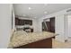 Well-lit kitchen with granite countertops, stainless steel appliances, and dark wood cabinetry at 2519 E Geneva Dr, Tempe, AZ 85282