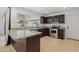 Modern kitchen boasts granite countertops, stainless appliances, and a window overlooking backyard patio at 2519 E Geneva Dr, Tempe, AZ 85282
