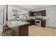 Modern kitchen boasts granite countertops, stainless appliances, and a window overlooking backyard patio at 2519 E Geneva Dr, Tempe, AZ 85282
