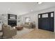 Inviting living room with a fireplace, built-in shelves, and neutral-toned furniture at 2519 E Geneva Dr, Tempe, AZ 85282