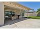 Covered outdoor patio with seating area overlooking the pool at 2519 E Geneva Dr, Tempe, AZ 85282
