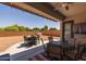 Inviting covered patio with ceiling fan and comfortable seating area, perfect for outdoor dining at 2750 W Pollack St, Phoenix, AZ 85041